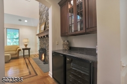 Between the living and dining room, you'll find a butler's pantry with a refrigerator and wine fridge.