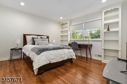 Bedroom 4 with hardwood floors, base and crown moldings, recessed lights, a double window and double fitted closer