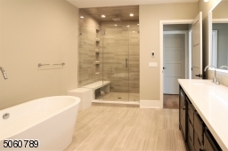 Separate tub, oversized shower, commode room, and heated floors