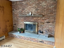 wood burning fireplace accent brick wall