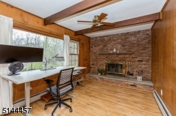 currently used as a home office wood burning fireplace picture window fan direct access to deck
