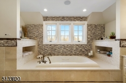 The nooks on either side of the jacuzzi offer great storage and zen ambience