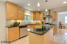 Kitchen with granite counters and stainless appliances.