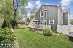 Rear yard is level, fully fenced and lushly landscaped