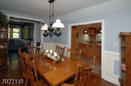 Large Formal Dining Room with Wainscoating and Crown Molding