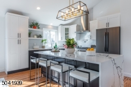 Designed with the discerning gourmet in mind, this stylish modern kitchen comes outfitted with sleek cabinetry, a spectacular quartz center island and professional grade appliances. Don?t be surprised when guests keep coming back to the kitchen!