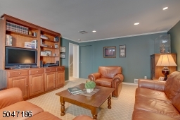 Cozy Family Room with built in custom cabinetry for entertainment center.