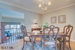Formal Dining Room with crown molding and pantry/china closet.
