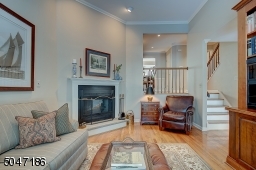 Woodburning Fireplace, Hardwood floors and crown molding.