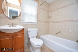 Nicely showing the full bathroom with both tub and shower