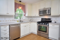 Flooring in kitchen is laminate wood