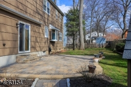 Sliders off the family room take you out to the Paver patio