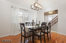 Formal Dinning Room with modern light fixture, sparkling wood floors
