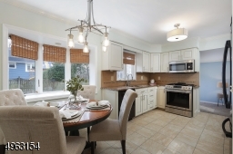Modern light fixtures, Anderson bay window, stainless steel sink and SS microwave and range