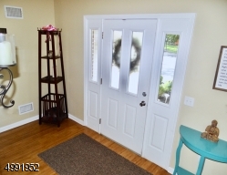 Entry Foyer with Gorgeous Bamboo Flooring and double closet