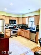 With SS Appliances and Granite Countertops