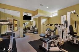 The home's fully-finished, lower level offers a fabulous, nicely-equipped gym. It's all there for you ~ one simply has to use it.