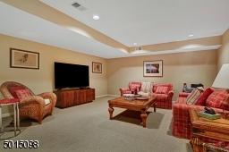 The recreation area is too large to fully reveal. Not seen is the opposing end of the space. Also not seen is the 600 bottle, temperature-controlled wine cellar and the arts & craft's room with a slop sink and storage cabinetry.