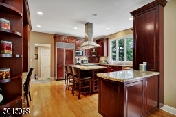 The kitchen offers all granite surfaces; pro-grade appliances, furniture-quality cabinetry and is situated directly opposite the family room.