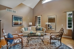 This room is especially appealing in that it offers a volume ceiling and seemingly flooded with warm ambient lighting most of the day.