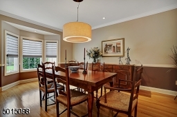 The formal dining room offers pinpoint recessed illumination and could easily seat twelve or more adults.