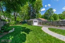 Fenced yard is beautifully landcaped