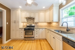 Renovated Kitchen with white cabinets, quartz counters & tons of storage