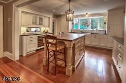 Designer Kitchen by Canterbury, La Cornue stove, pot filler, 2 Sub-Zero refrigerators with freezer drawers, wine cooler, expansive islandView from Kitchen to Dining Room