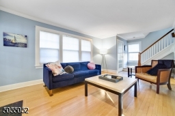 Painted soothing grey hues with gleaming hardwood floors, gracious floor plan and flow.