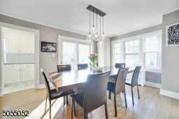 Formal Dining Room accesses the oversized wood deck via glass sliders and also flows seamlessly to the crisp white Eat-In Kitchen.