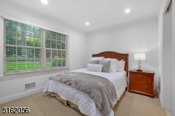Bedroom 6 is en-suite and features wall-to-wall carpeting, a double window and a closet