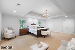 Sitting area, dressing area with a wall-to-wall marble vanity and a large fitted walk-in closet