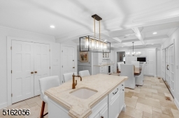 Granite counters, SS appliances (incld. double Fisher & Paykel wall ovens, Viking Professional 6 burner gas stove top) SubZero paneled refrigerator, 2 dishwashers, wine refrigerator, white tile backsplashes, walk-in pantry, apron sink w/ a double window