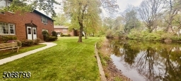 Located behind condo unit. Enjoy view from Living Room window or walk out through private back door.