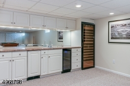 Wet bar with two wine refrigerators
