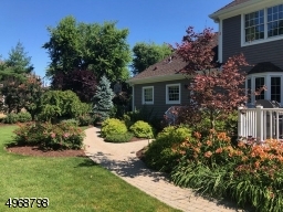 Backyard is fully landscaped with flowers blooming from Spring thru Fall!  Sprinkler System - front & backyards