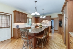 Fabulous center island, all granite countertops and tumbled marble backsplash