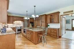 Custom Cherry wood cabinetry, custom sink and pot filler faucet