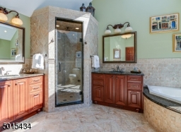His & Hers vanities, jetted tub,glass enclosed shower with sunflower shower head and body sprays! Skylight!
