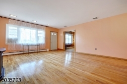 Living Room- picture window - view of the office/bedroom with sliding doors