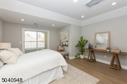 Retire to your master suite with private balcony, oversize walk-in closet Rich wide 4.5 inch wood oak flooring