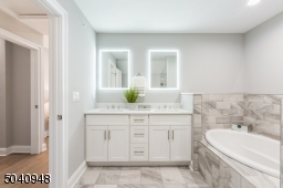 This bathroom will fit seamlessly into your lifestyle. Dual vanity, quartz  countertop, oval soaking tub.