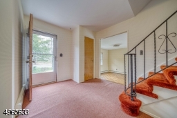 Large entry way with coat closet and powder room