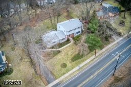 With privacy landscaping and set back off the road.