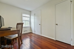 first floor bedroom, currently being used as an office w/ closet & half bath