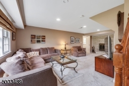 Wood-burning Fireplace access to laundry room / powder room and garage