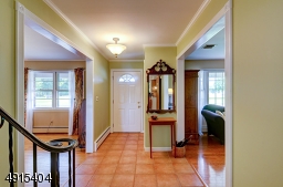 Staircase away from the foyer and into the home's center frees up circulation