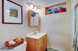 Full Bath with Stall shower and built in shelving for linens, make a functional space even more accommodating!