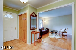 Entry Foyer complete with double coat closet , there are little to no compromises in  this floor plan and layout.