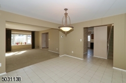 Leads to Kitchen and Steps to Upstairs